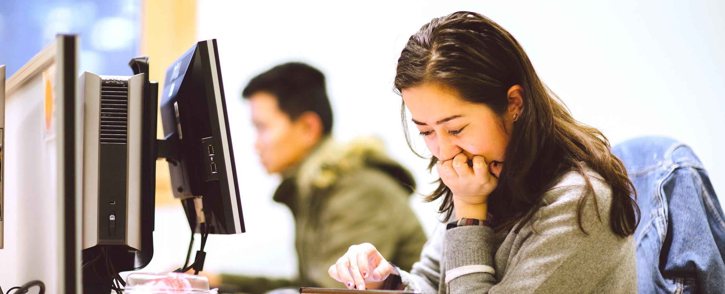 A student working at a computer in London Library